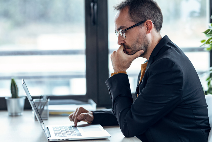 man looking concerned using computer - SimonMed Imaging data breach